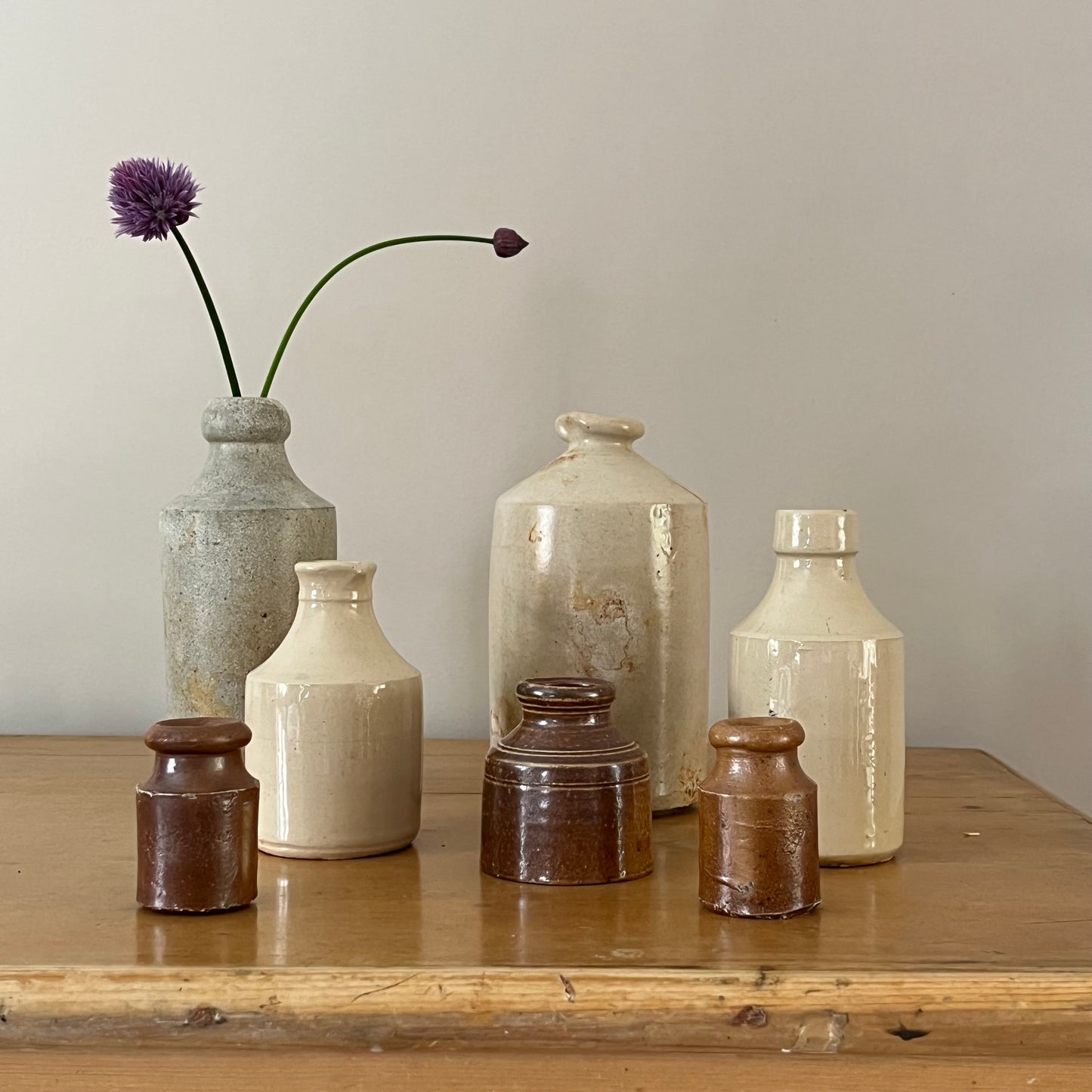 Set of Seven Stoneware Pots.