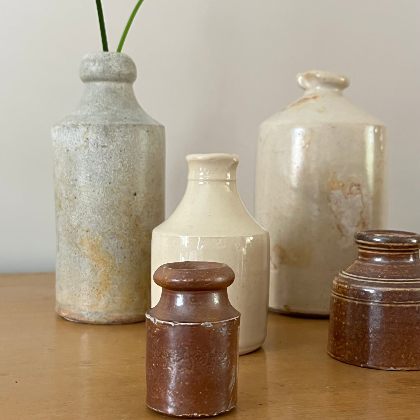 Set of Seven Stoneware Pots.