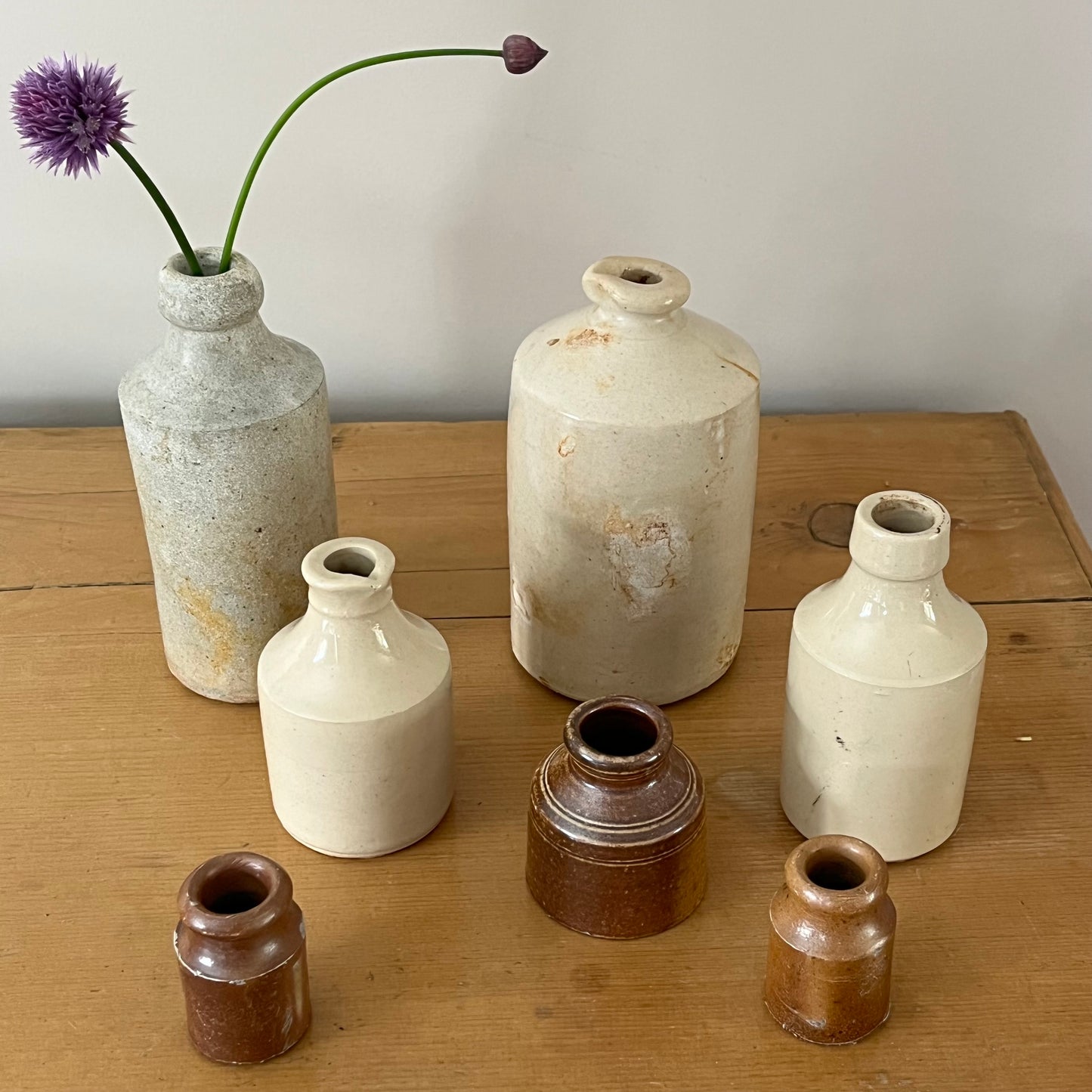 Set of Seven Stoneware Pots.