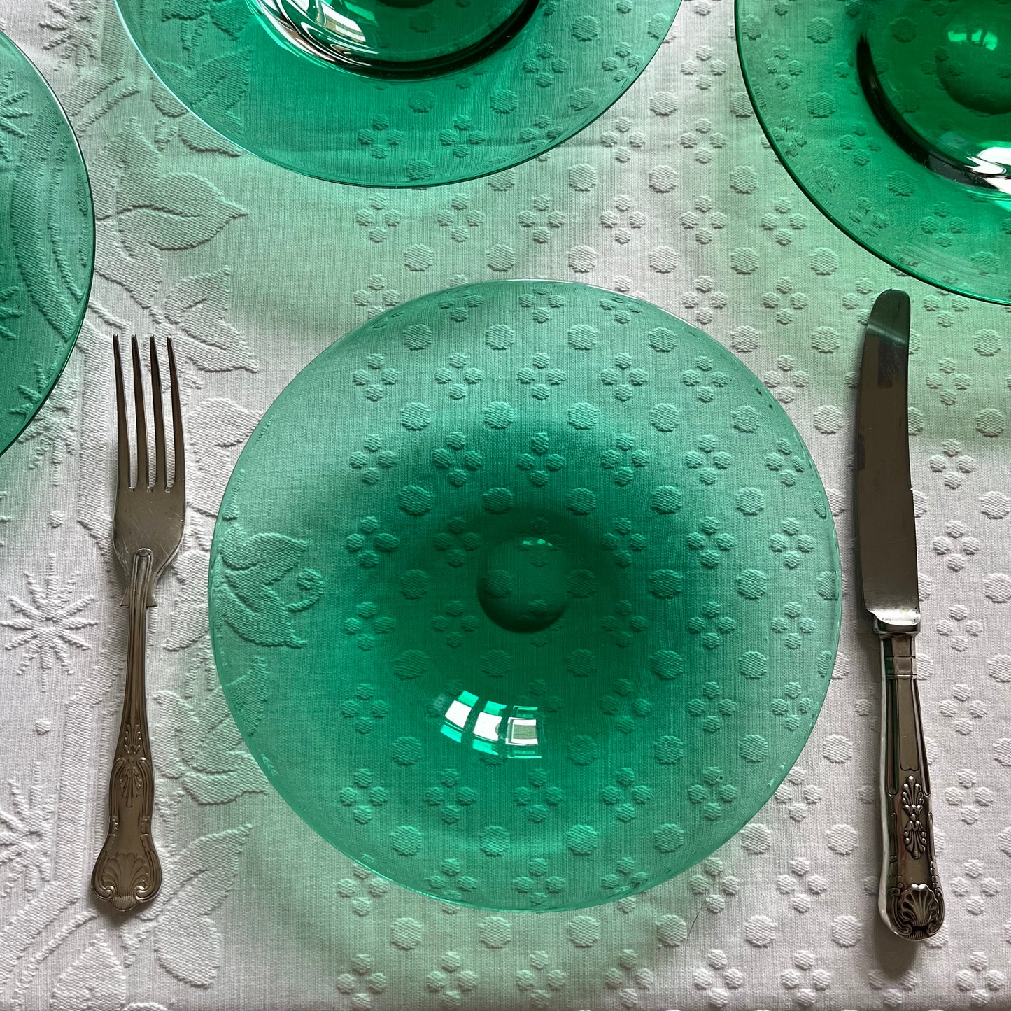 Set of Six Emerald Green Glass Plates.