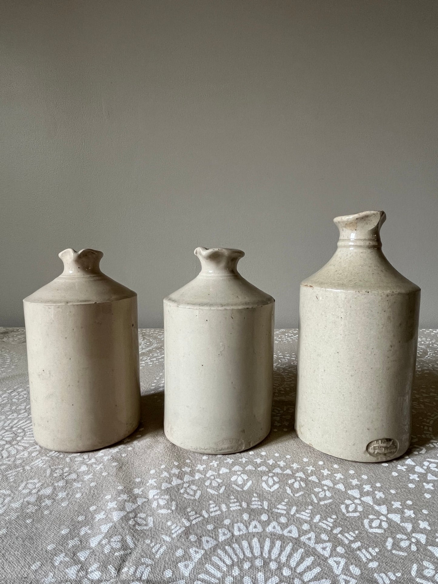 A set of Three Stoneware Pots.