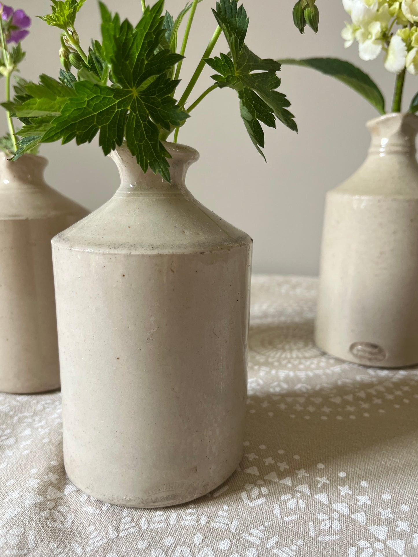 A set of Three Stoneware Pots.