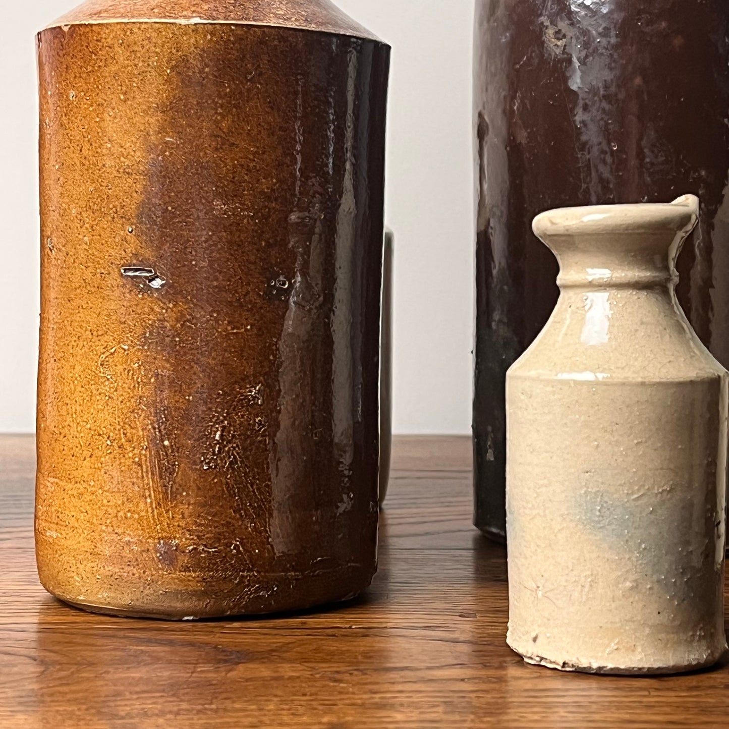 Set of Seven Stoneware Pots.