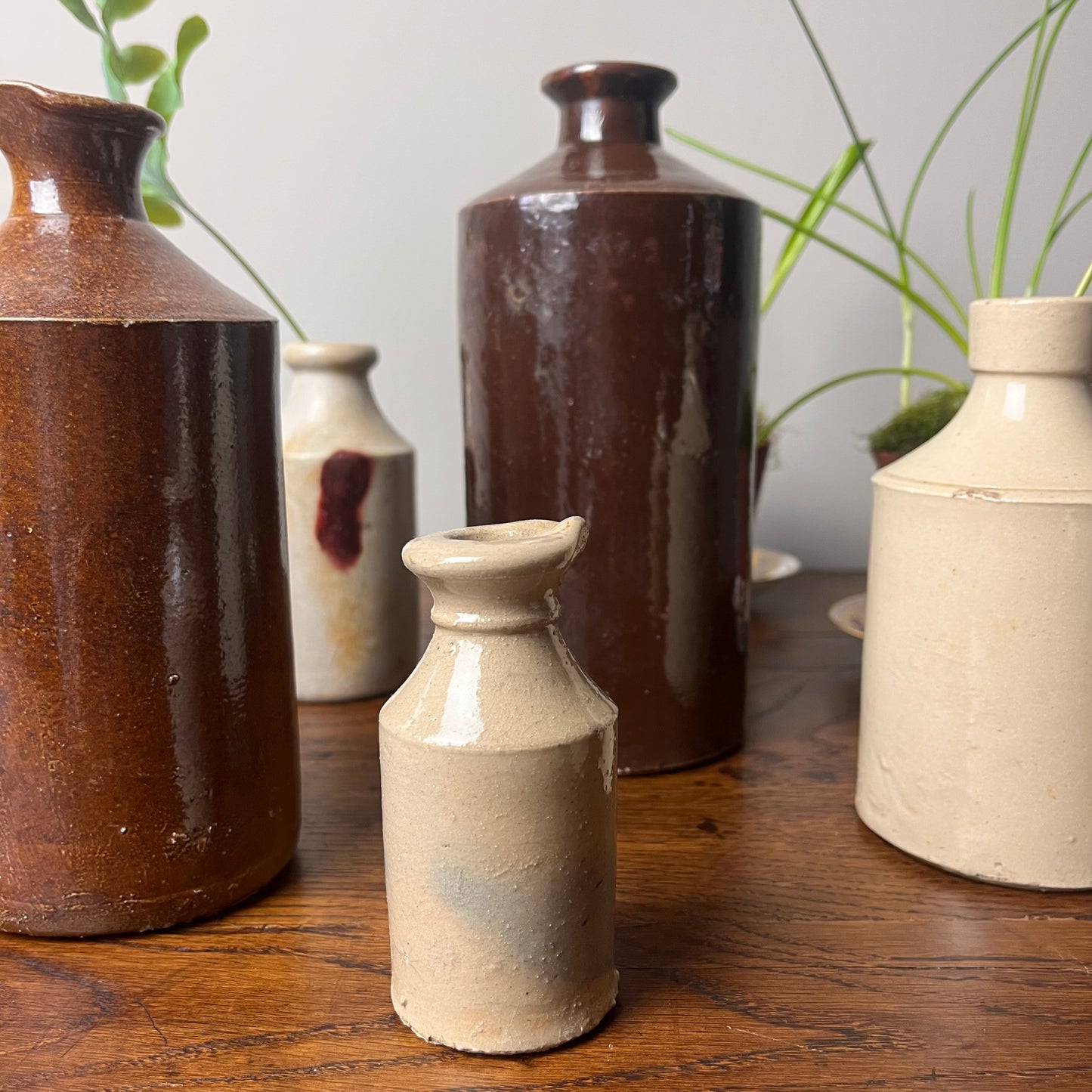 Set of Seven Stoneware Pots.