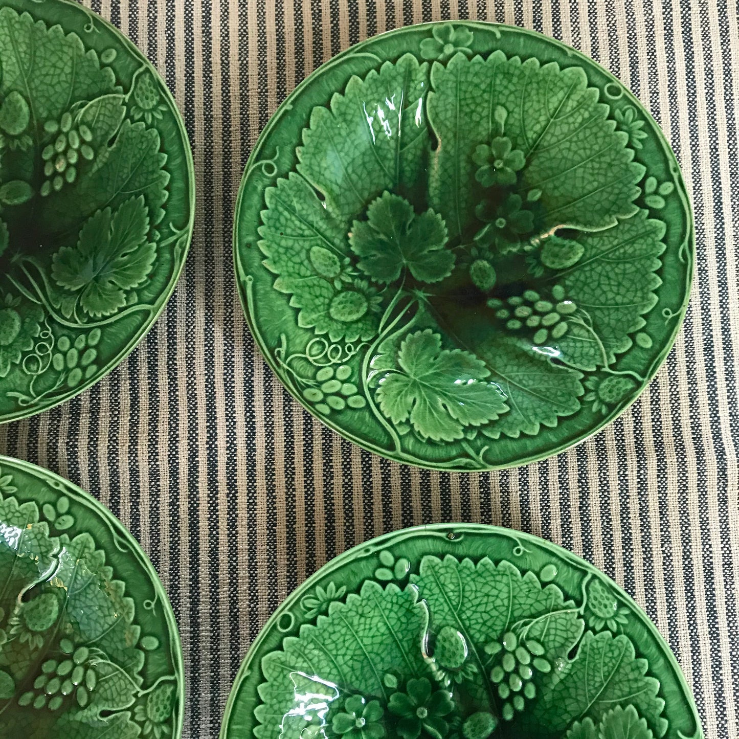 Set of Four Majolica Plates.