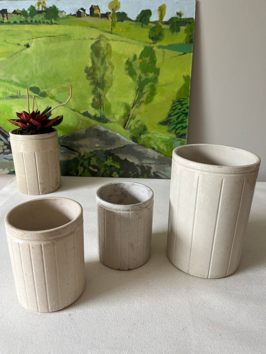 A Set of Three Stoneware Jam Pots.