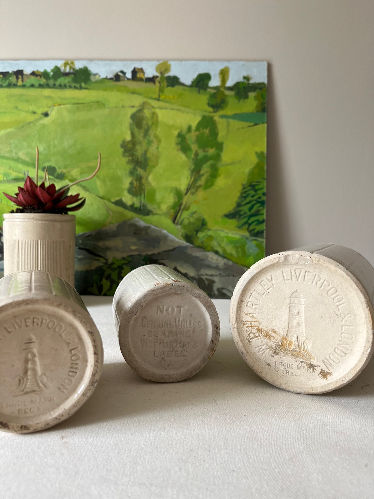 A Set of Three Stoneware Jam Pots.