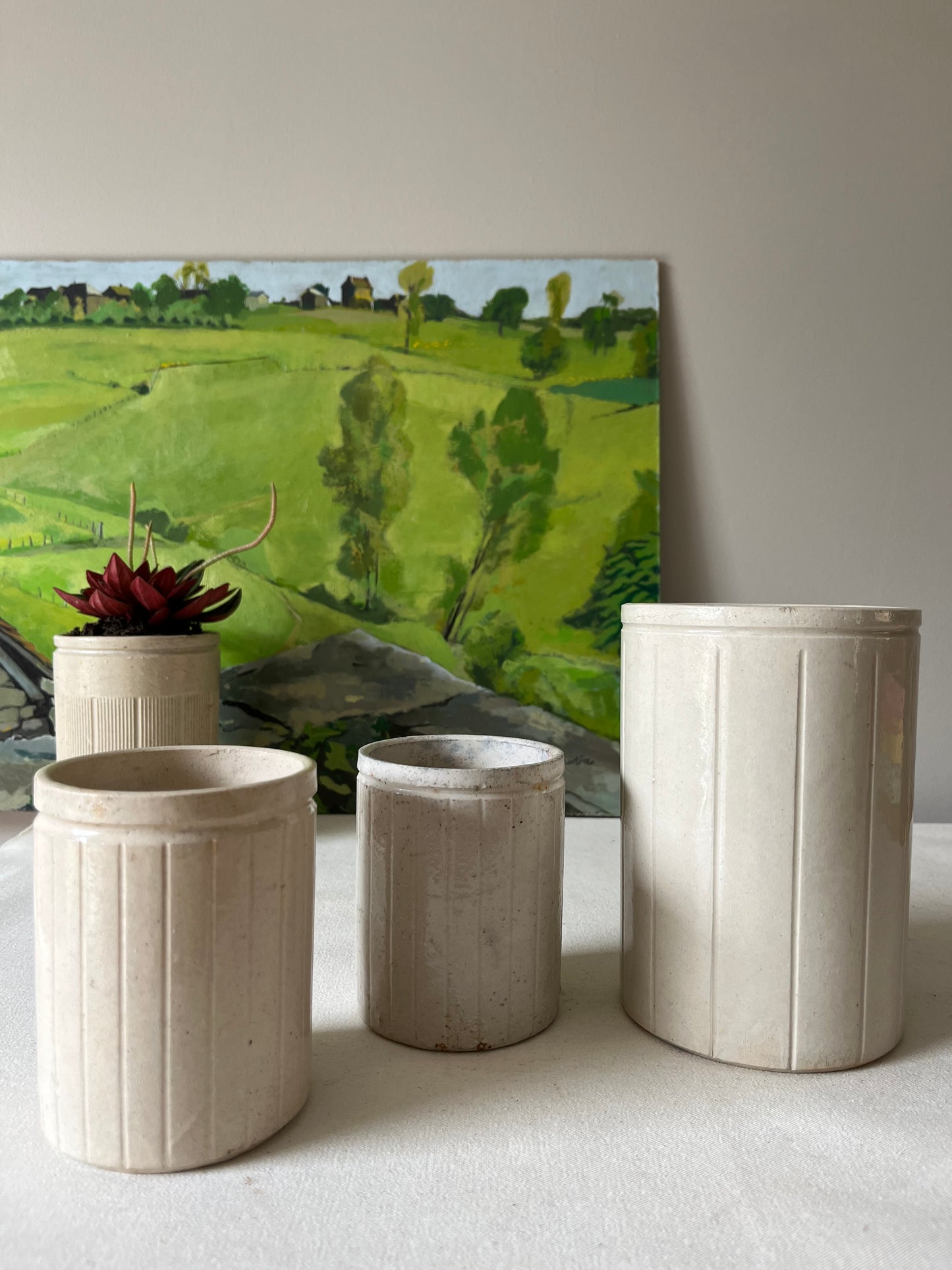 A Set of Three Stoneware Jam Pots.
