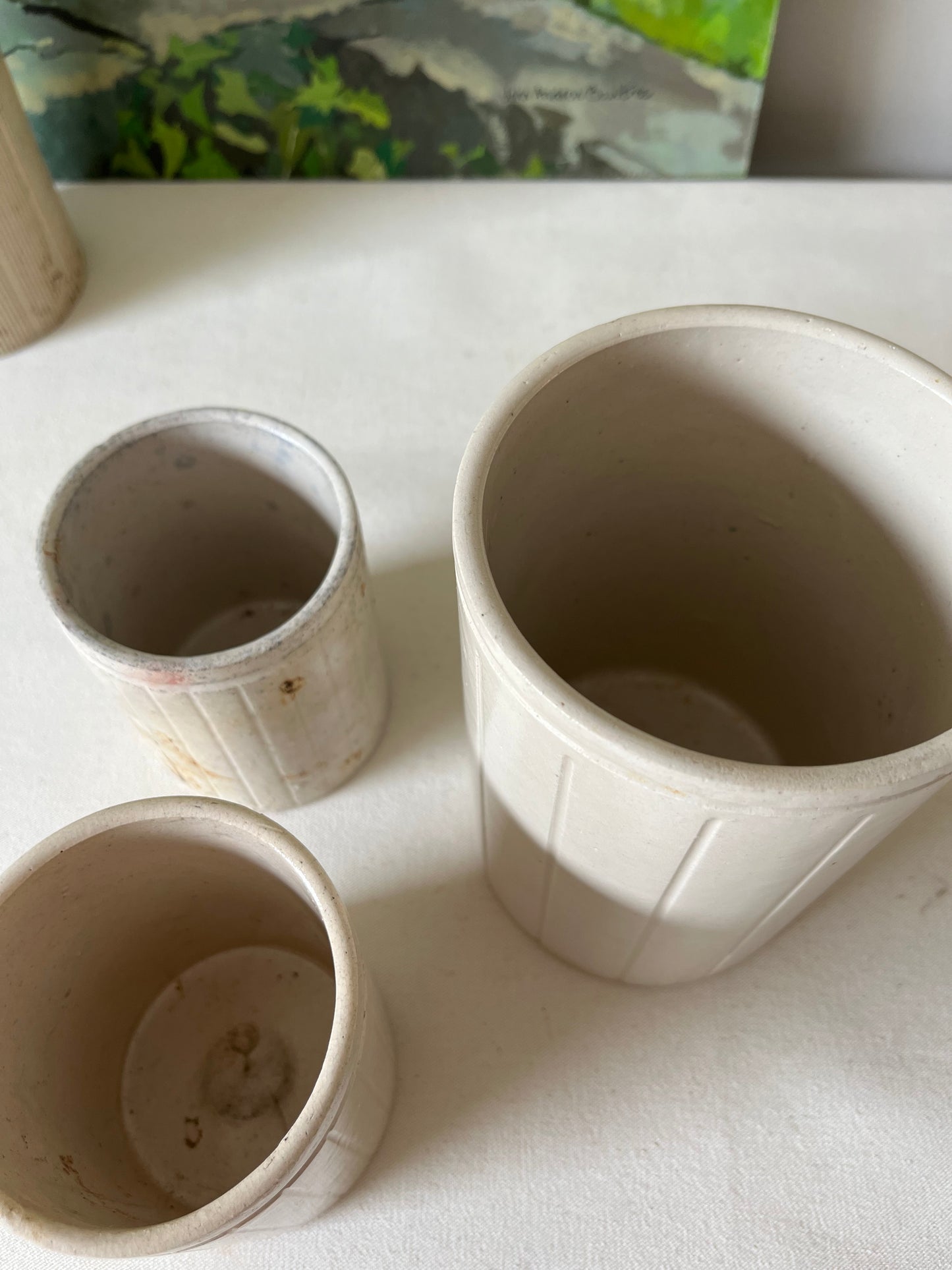 A Set of Three Stoneware Jam Pots.