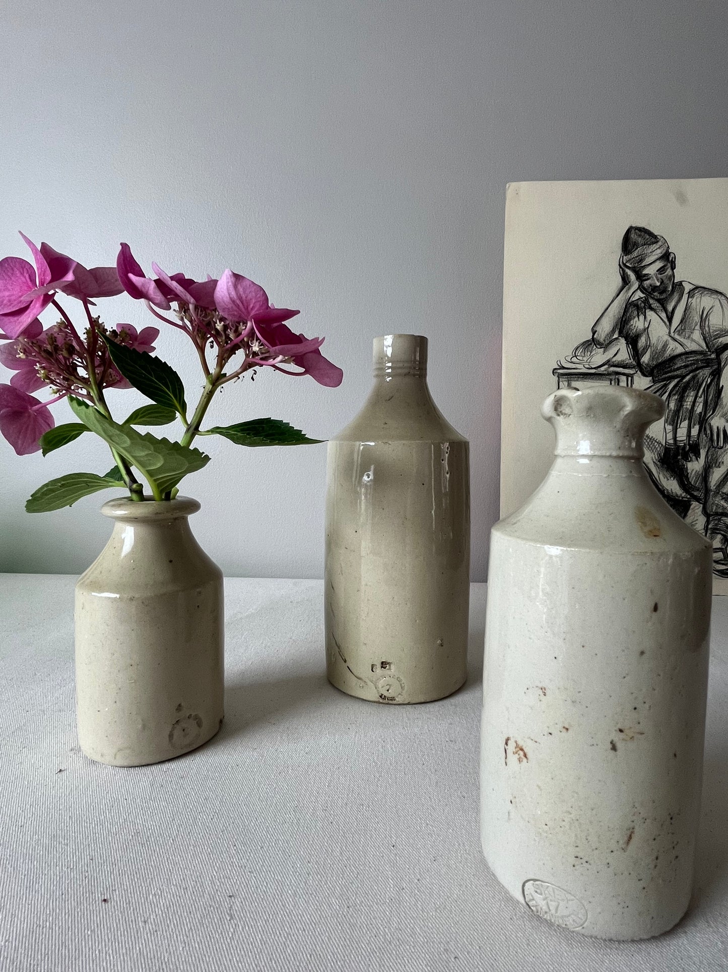 A Set of Three Stonewear Pots.