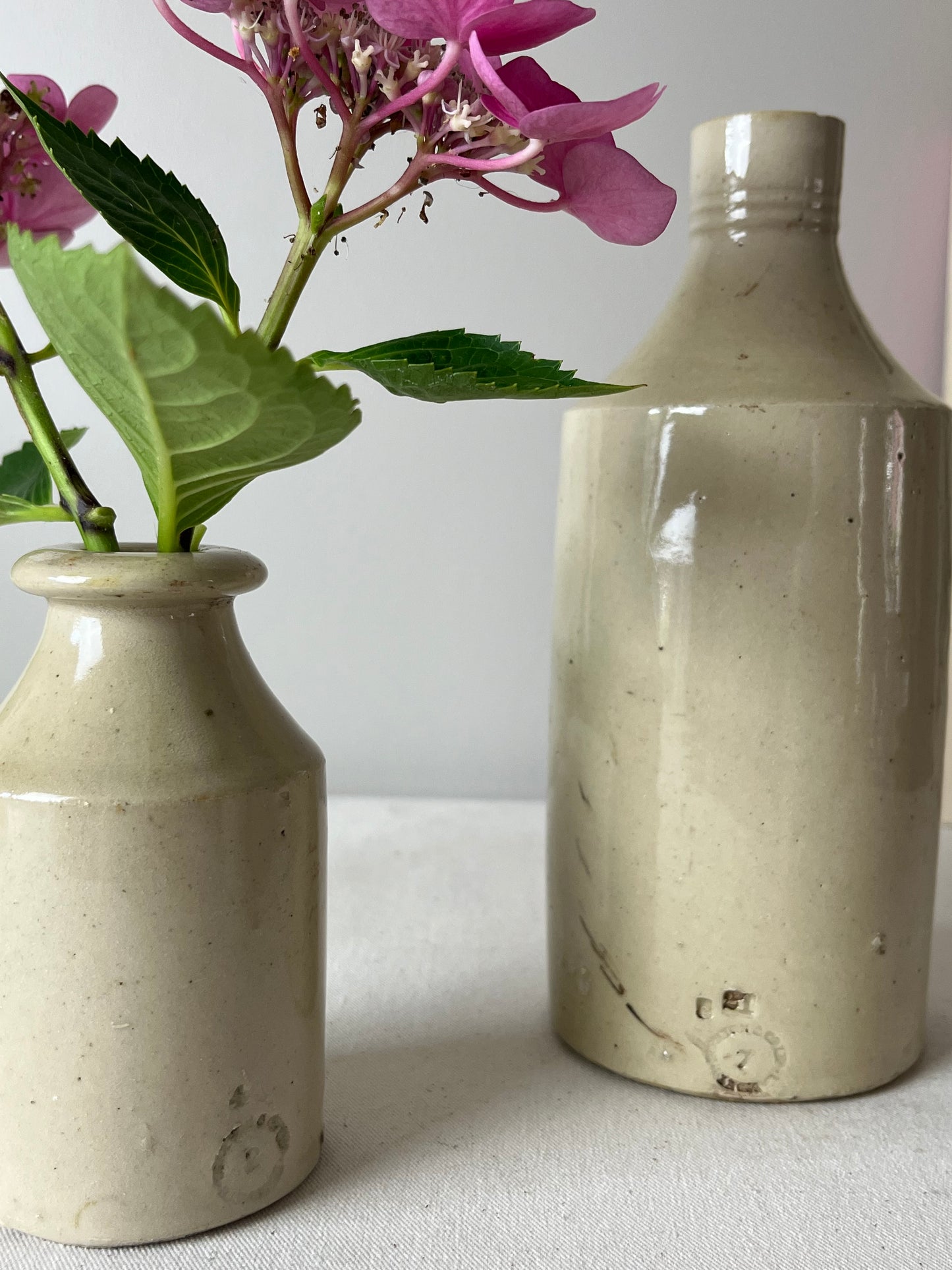 A Set of Three Stonewear Pots.