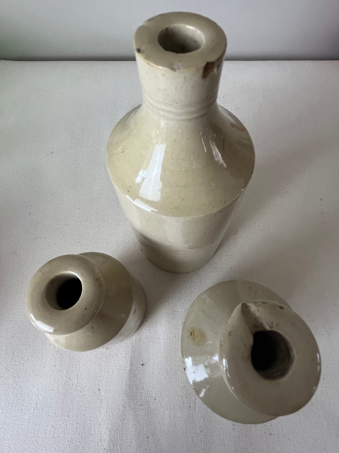 A Set of Three Stonewear Pots.