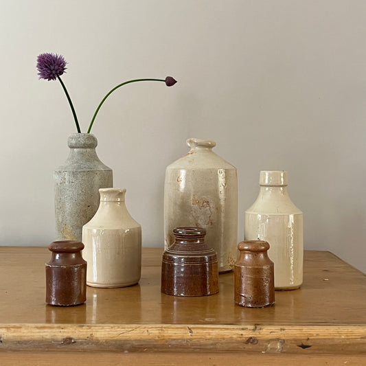 Set of Seven Stoneware Pots.