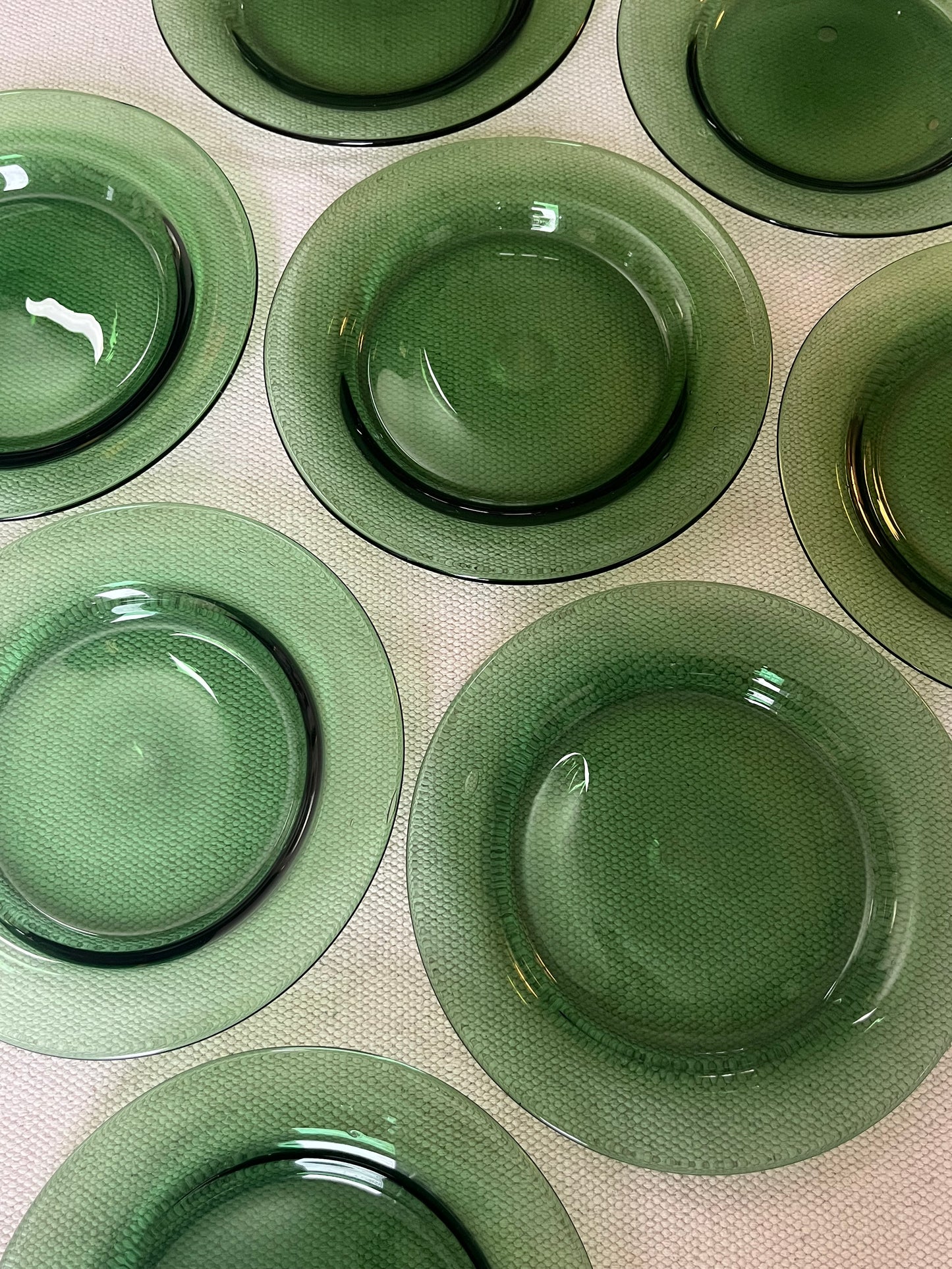 Set of Eight Green Glass Plates.