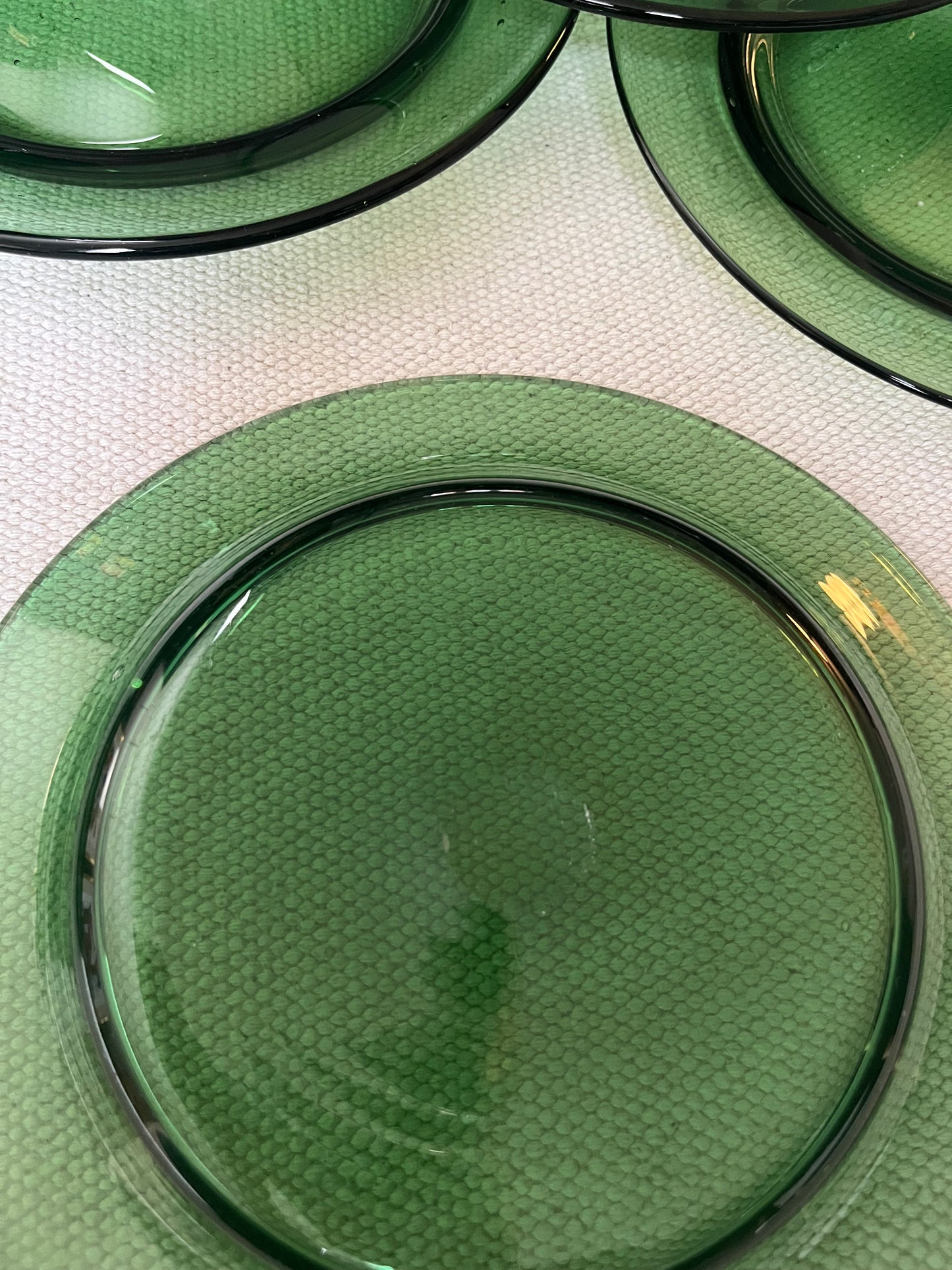 Set of Eight Green Glass Plates.