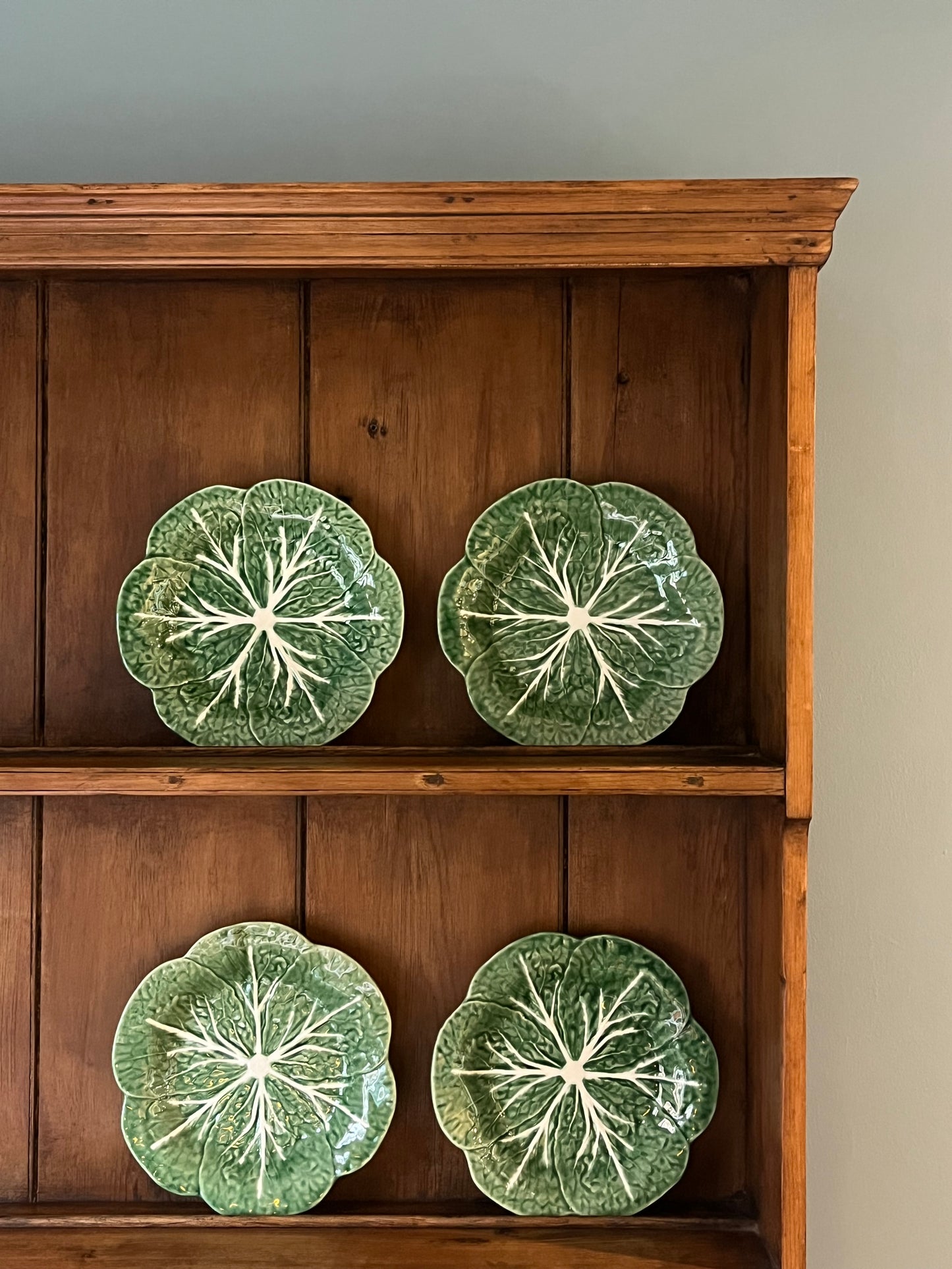 A Set Of Four Cabbage Plates.