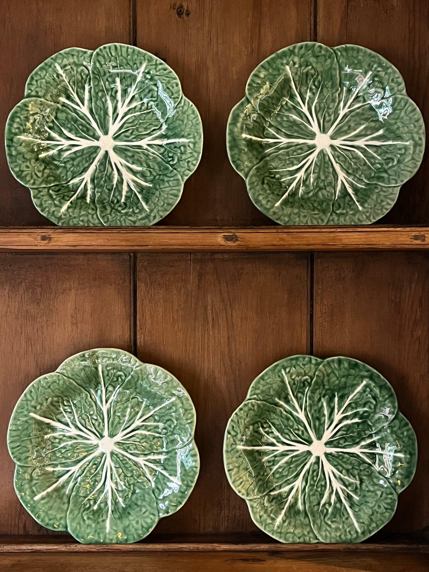 A Set Of Four Cabbage Plates.