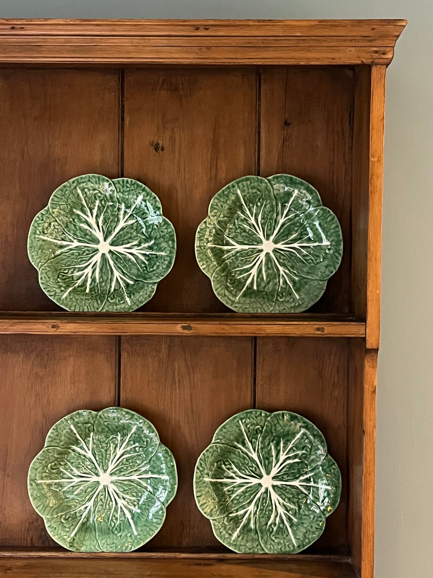 A Set Of Four Cabbage Plates.