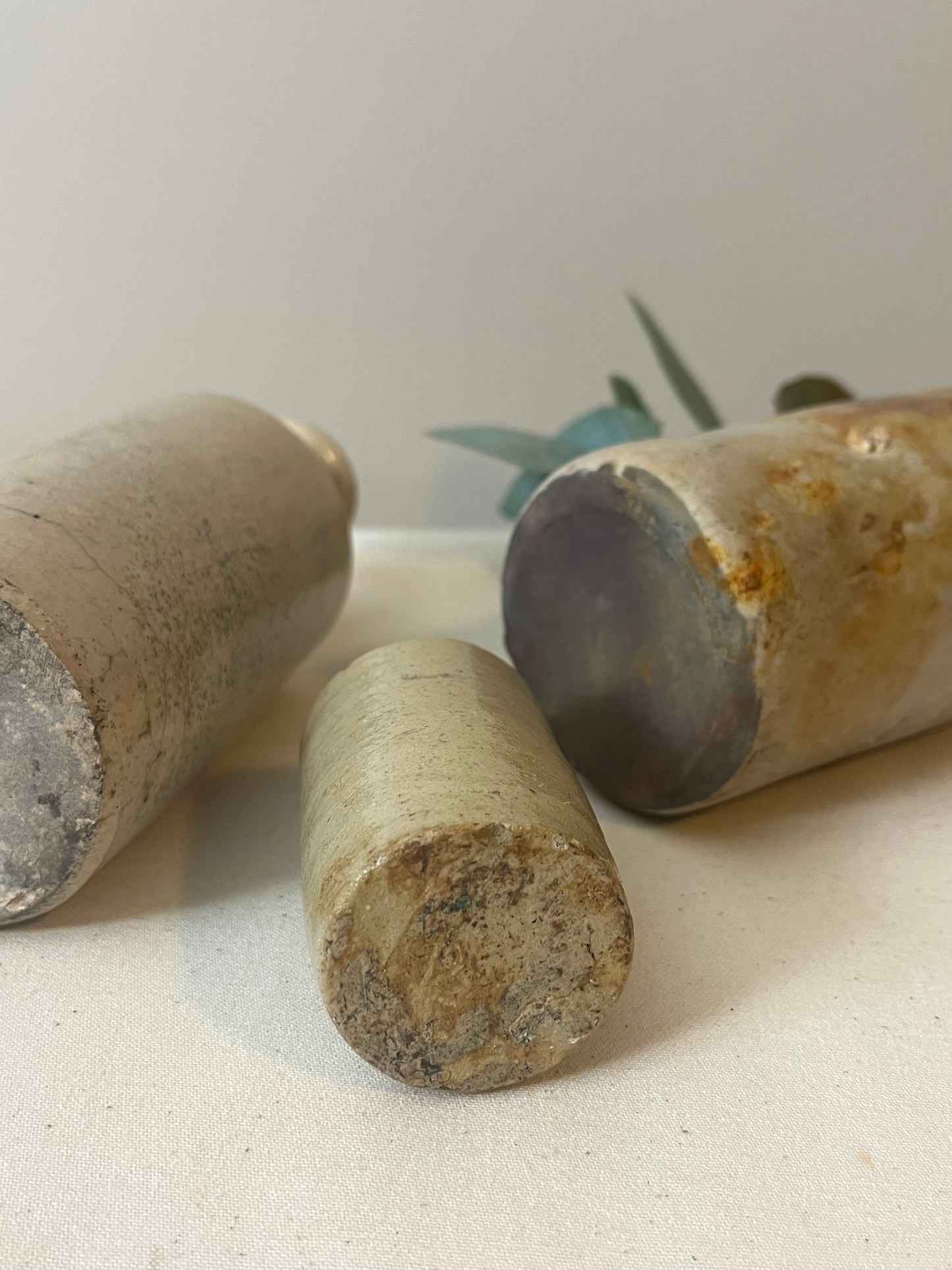 Set of Three Stoneware Bottles.