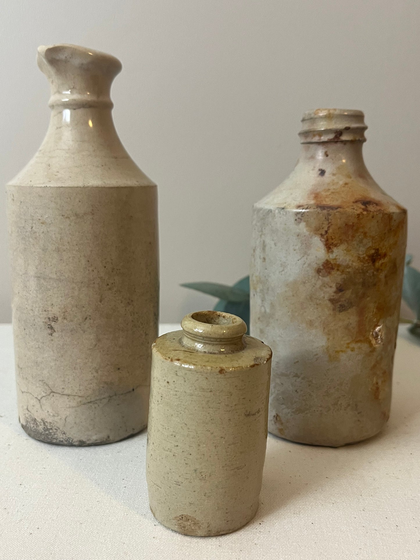 Set of Three Stoneware Bottles.