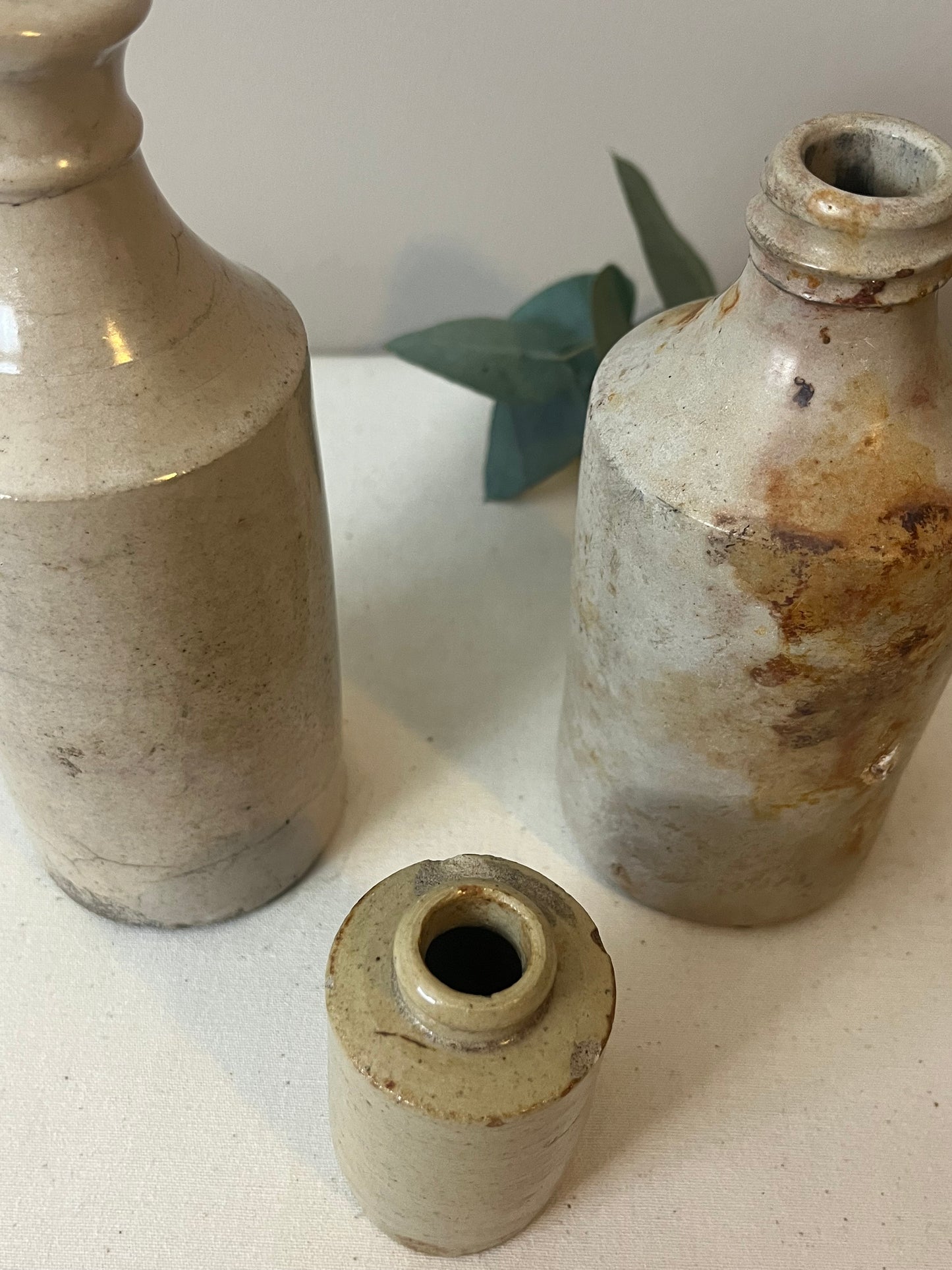 Set of Three Stoneware Bottles.