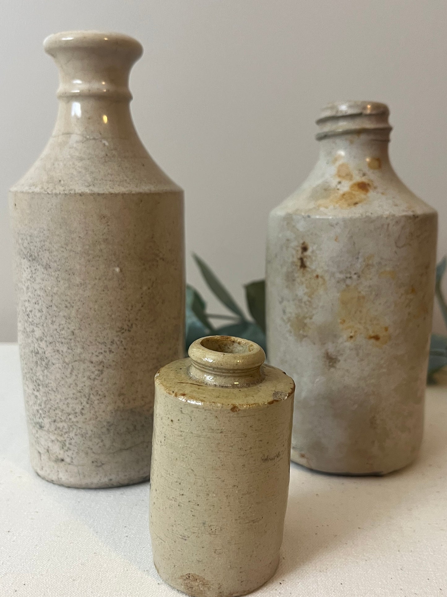 Set of Three Stoneware Bottles.