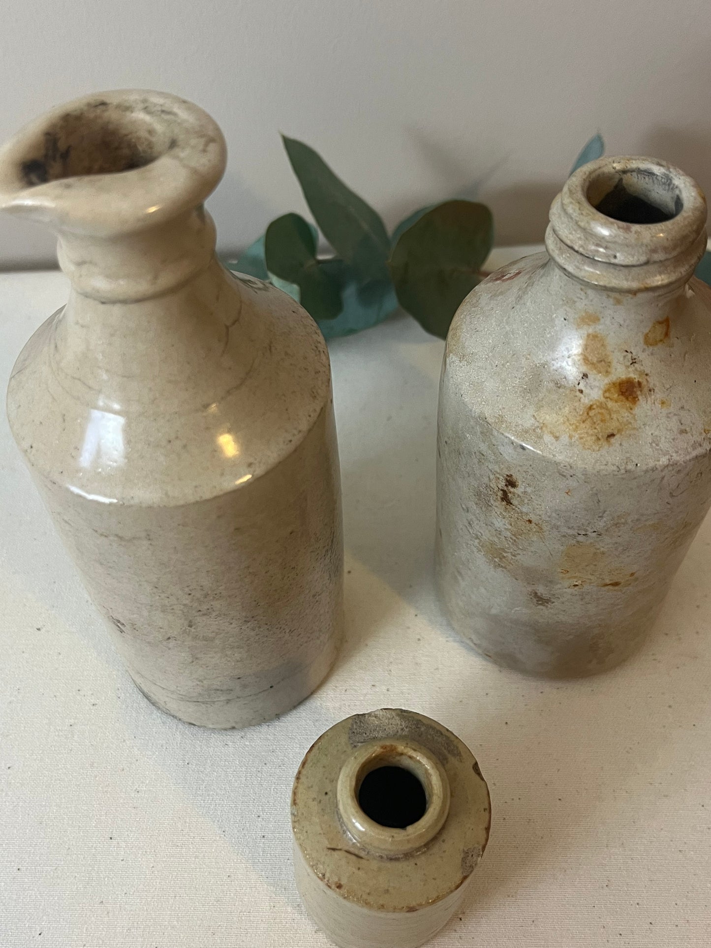Set of Three Stoneware Bottles.