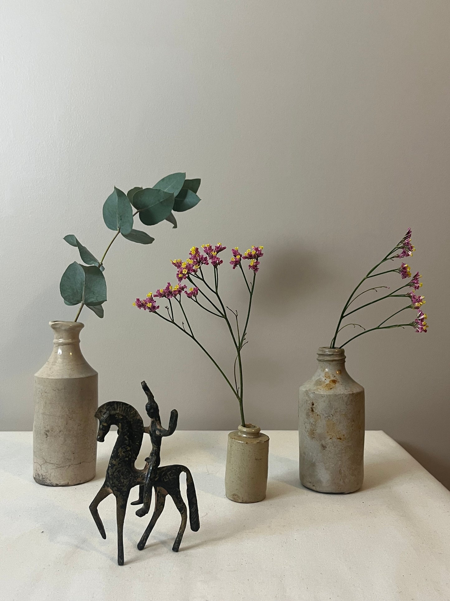 Set of Three Stoneware Bottles.