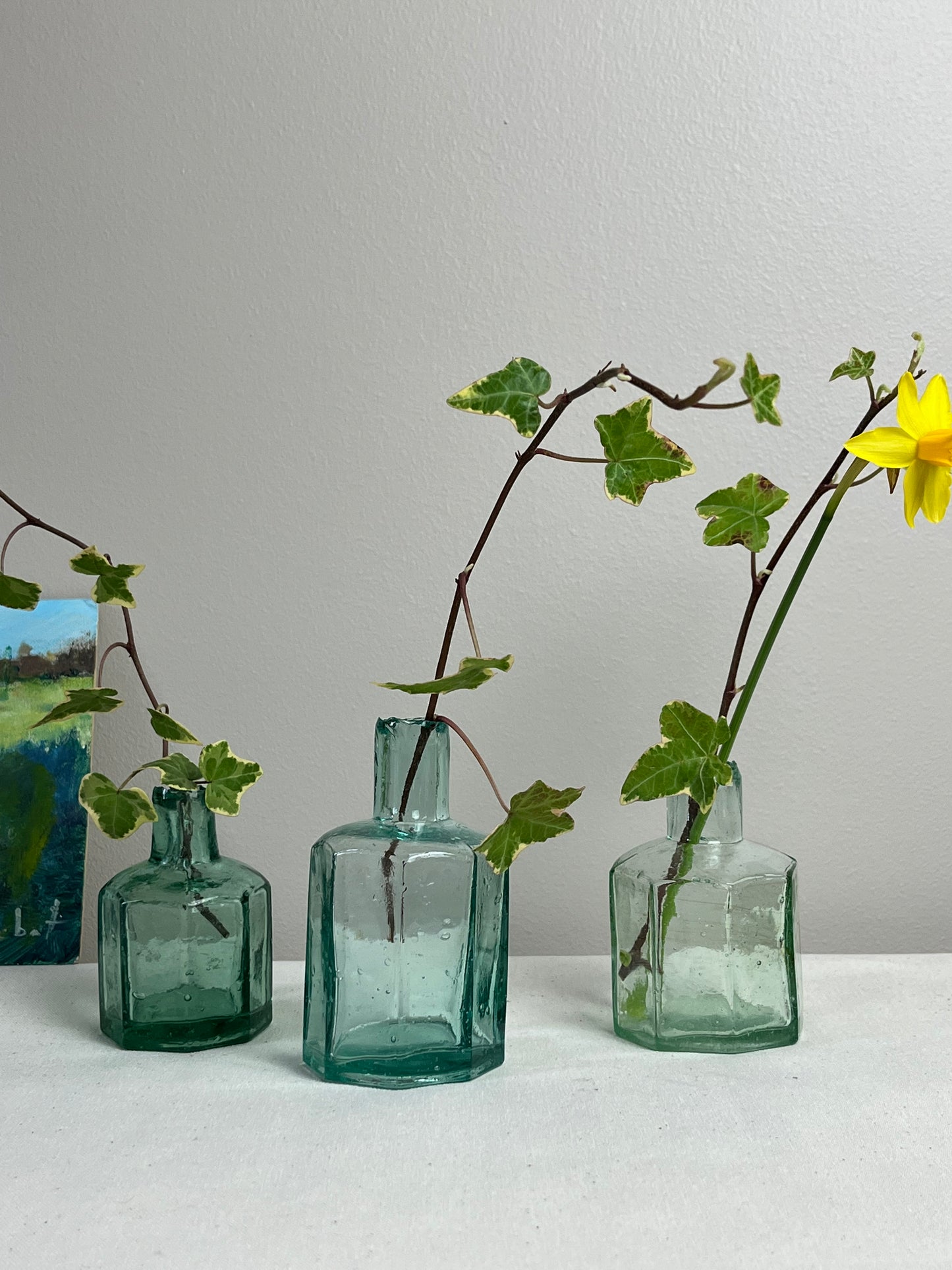 A set of Three Glass Ink Bottles.