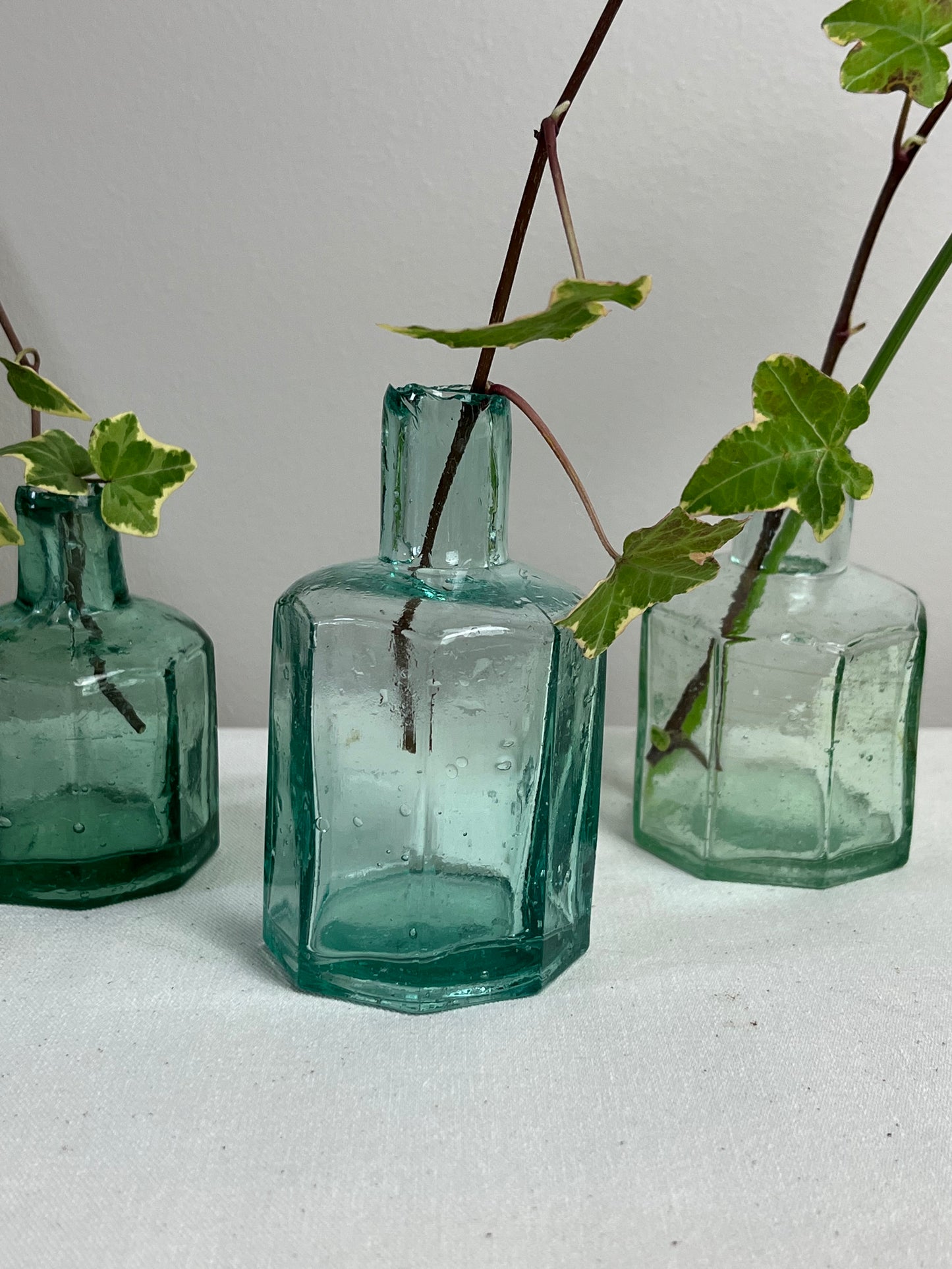 A set of Three Glass Ink Bottles.
