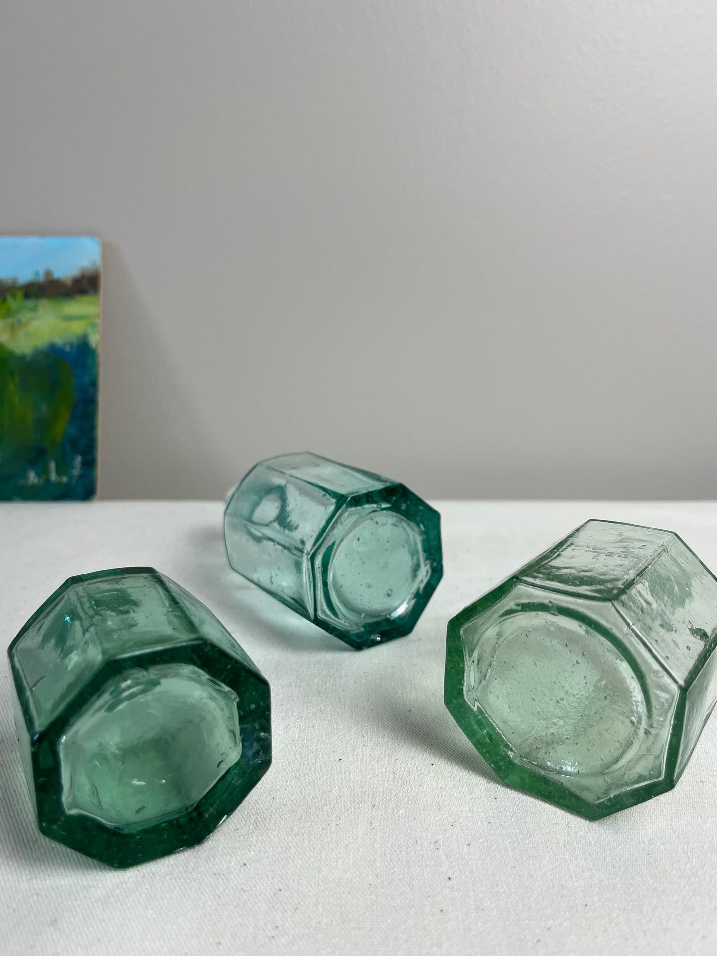 A set of Three Glass Ink Bottles.