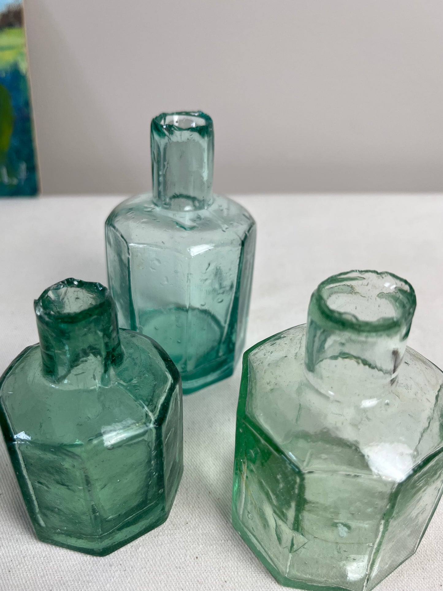 A set of Three Glass Ink Bottles.