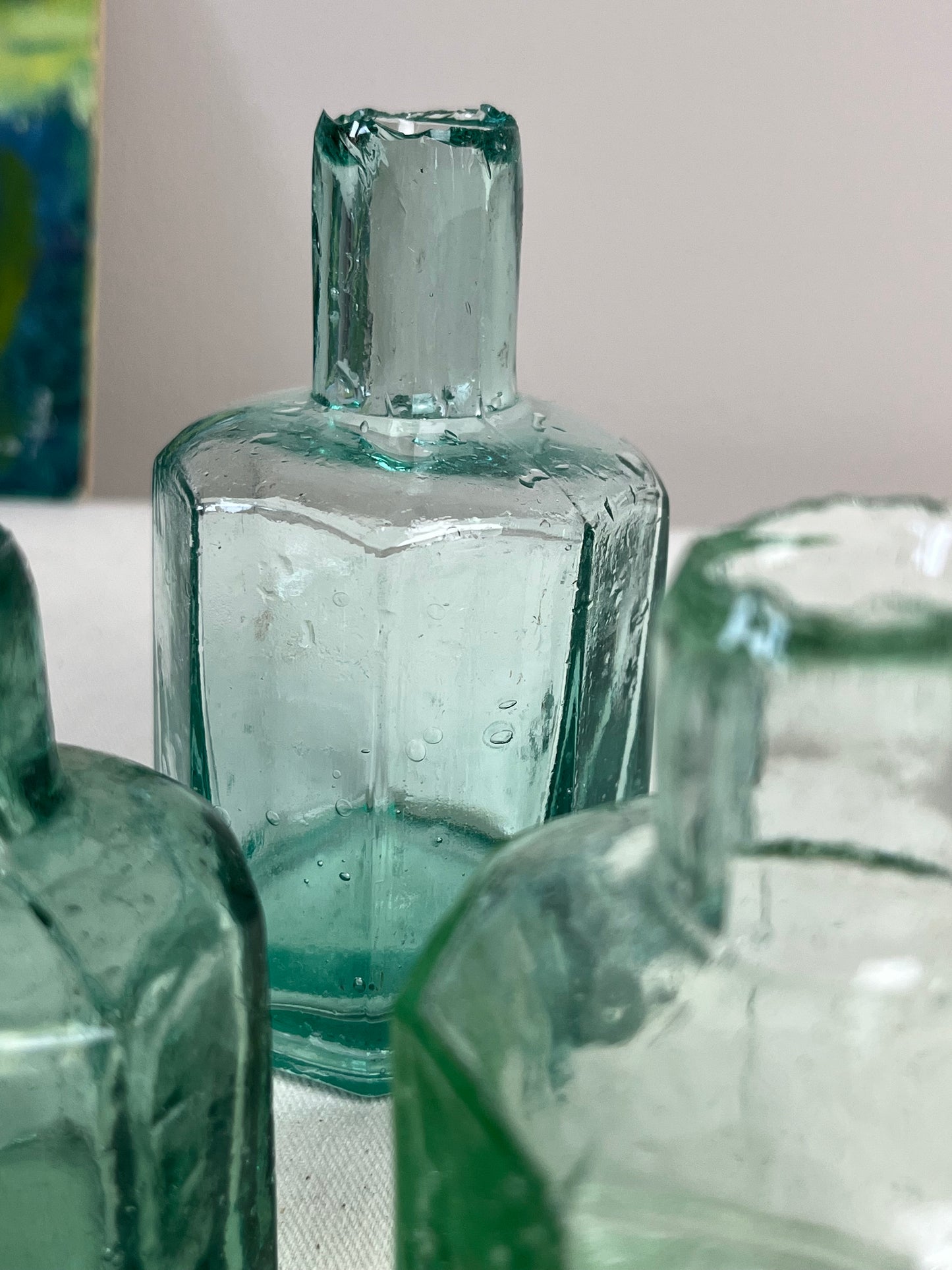 A set of Three Glass Ink Bottles.
