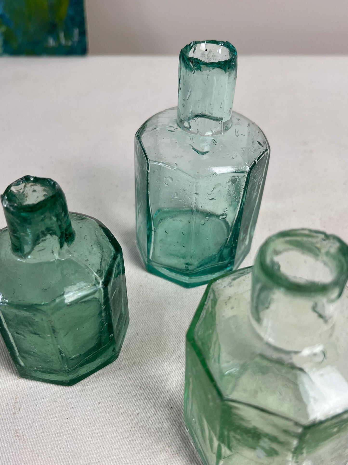 A set of Three Glass Ink Bottles.