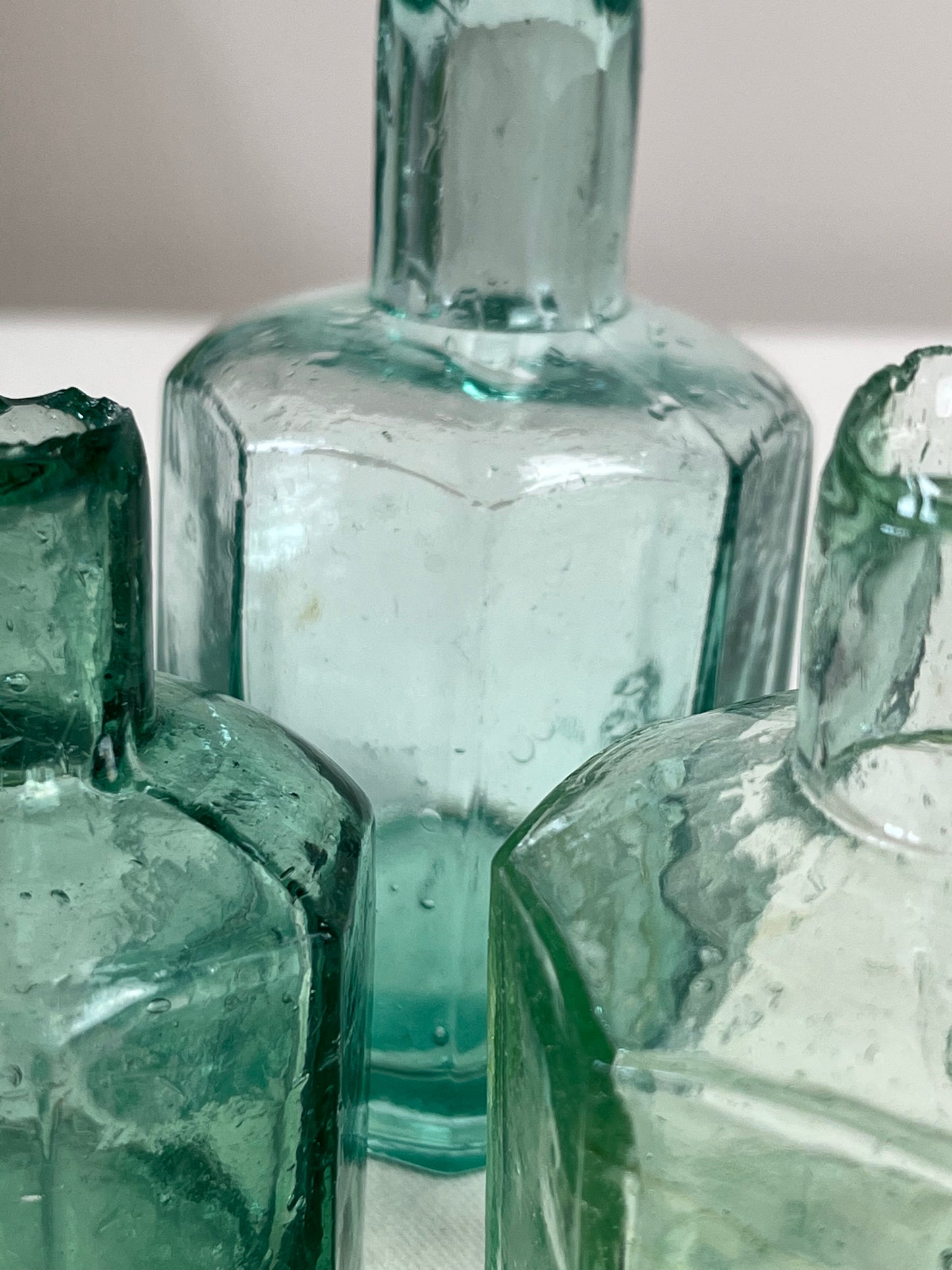 A set of Three Glass Ink Bottles.