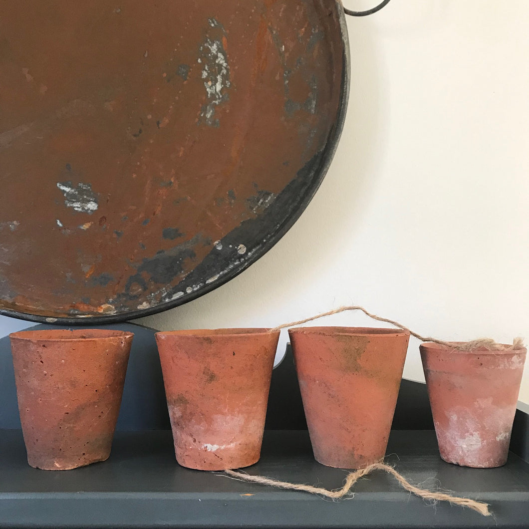Set of Four Terracotta Pots.